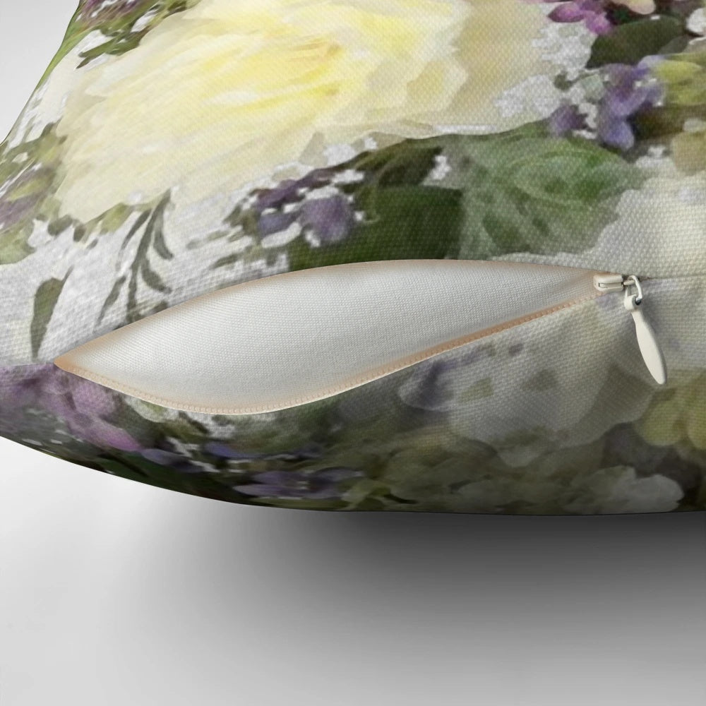 A watercolor painting of a bouquet featuring cream roses and purple flowers on a throw pillow