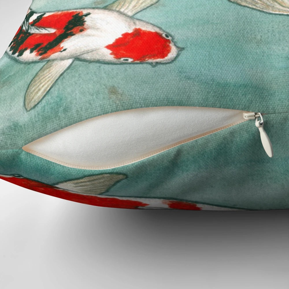 A decorative throw pillow featuring a beautiful watercolor painting of koi fish swimming in a pond.