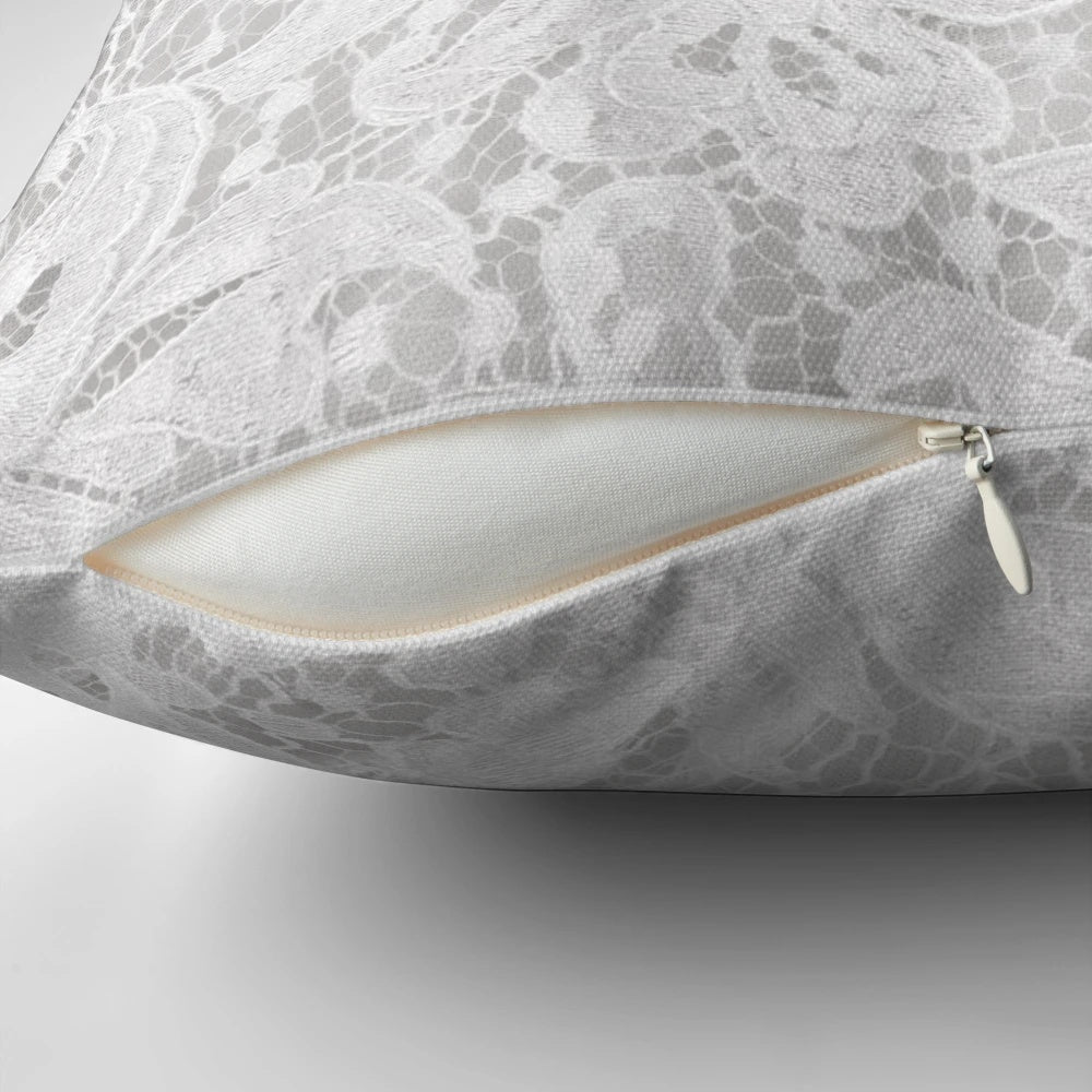 Luxurious white lace pillow with intricate floral embroidery, perfect for wedding and home decor
