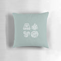 A blue pillow featuring the four elements of Avatar: The Last Airbender - earth, fire, air, and water.