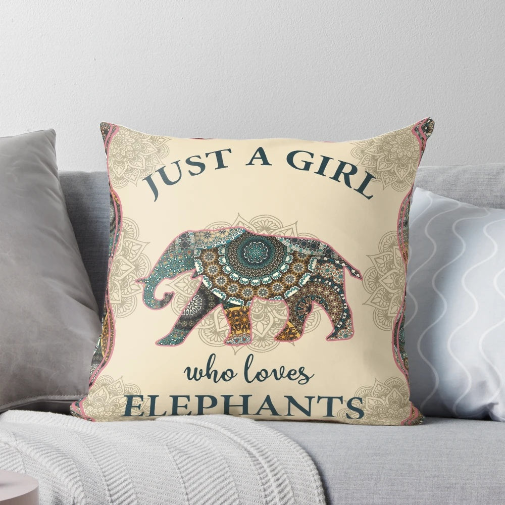 Colorful mandala design with an elephant in the center, printed on a cozy pillow