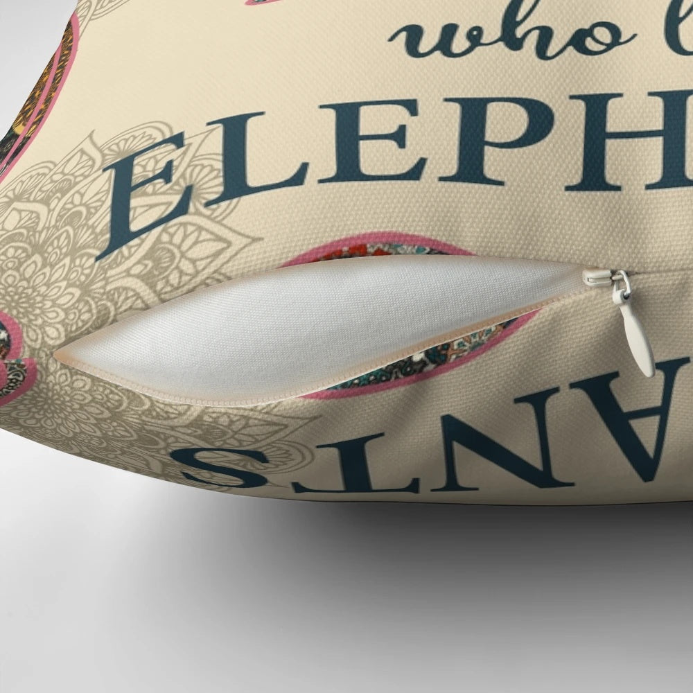 Colorful mandala design with an elephant in the center, printed on a cozy pillow