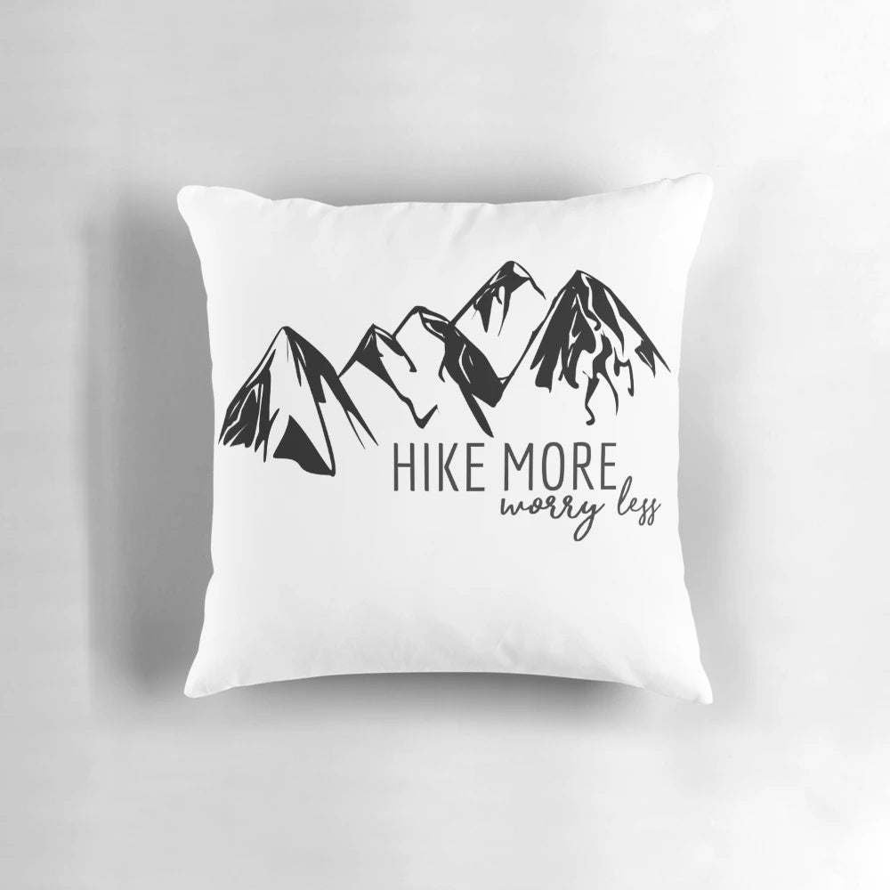 A cozy hiking pillow featuring a mountain graphic, perfect for outdoor adventures.