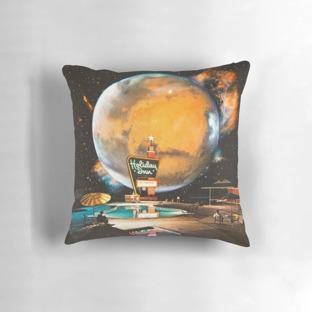 A surreal, retro-futuristic collage image of a space-themed pillow with planets, stars, and a swimming pool.