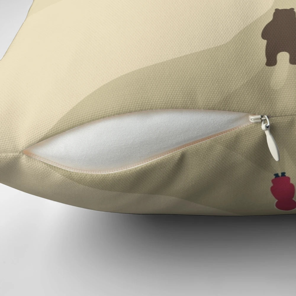 A soft, plush pillow featuring a brown bear design, perfect for travelers and adventurers
