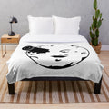 Plush blanket featuring a minimalist space exploration design