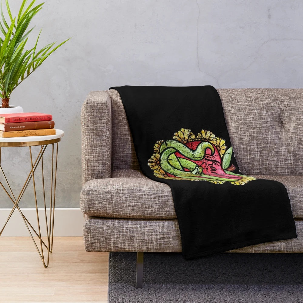 Cozy "Eve Was Framed" plush blanket featuring biblical feminist design