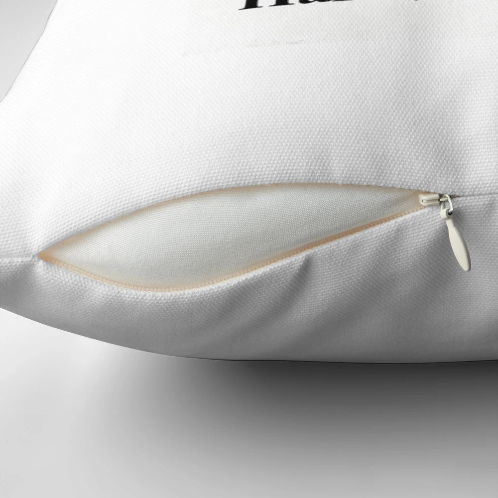 A simple white pillow with the text "Change Is Hard" in a minimalist outline design, inspiring personal reflection and growth.