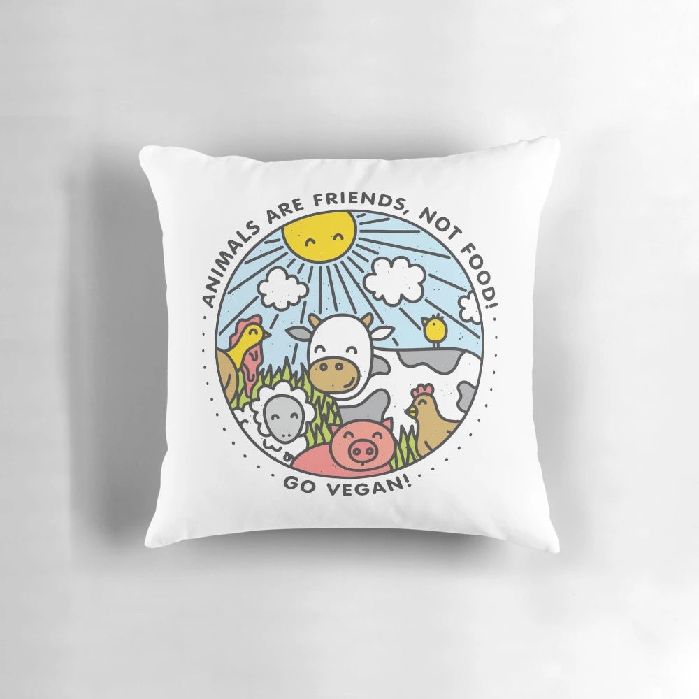 A stylish vegan pillow featuring a playful design of animals, promoting a message of compassion and veganism.
