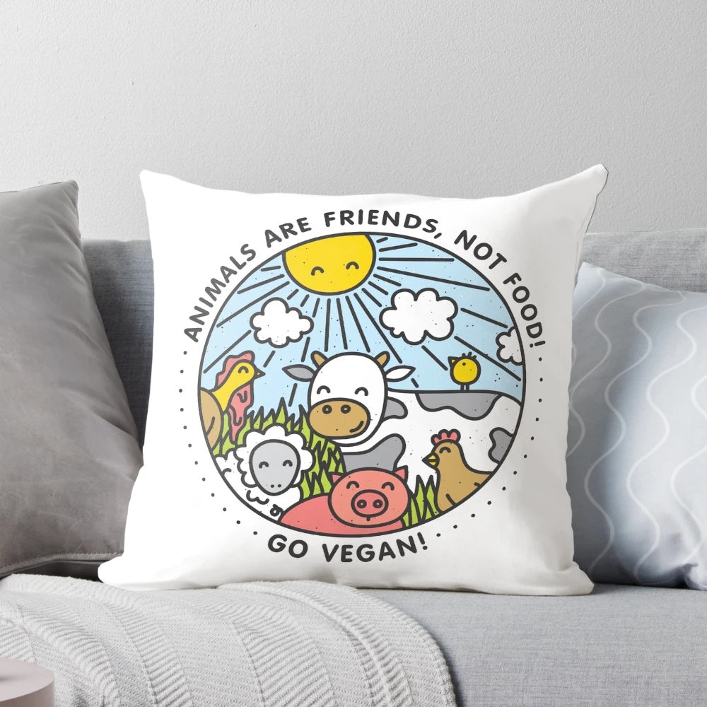 A stylish vegan pillow featuring a playful design of animals, promoting a message of compassion and veganism.