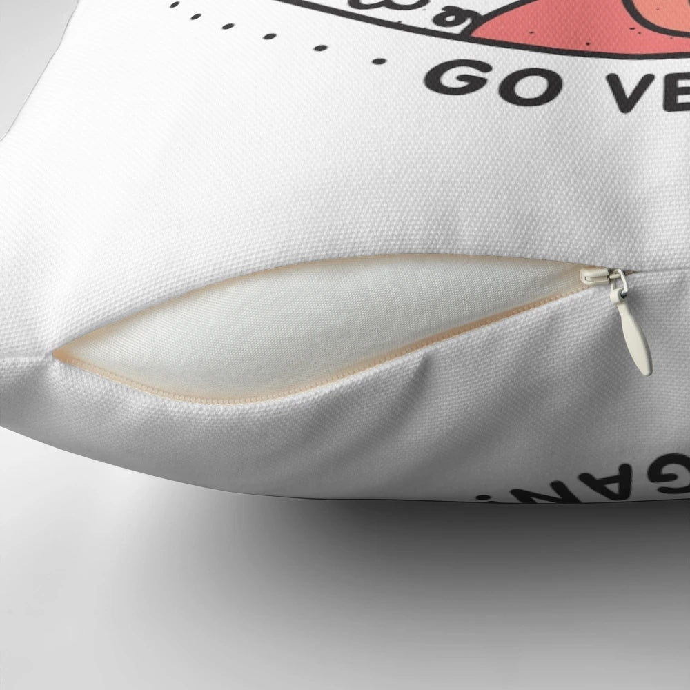A stylish vegan pillow featuring a playful design of animals, promoting a message of compassion and veganism.