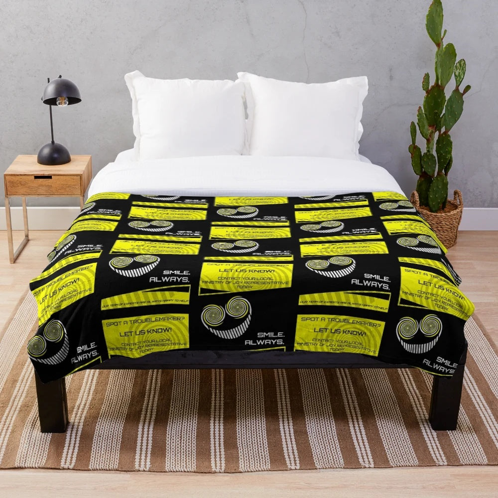 Plush blanket featuring a smiling character