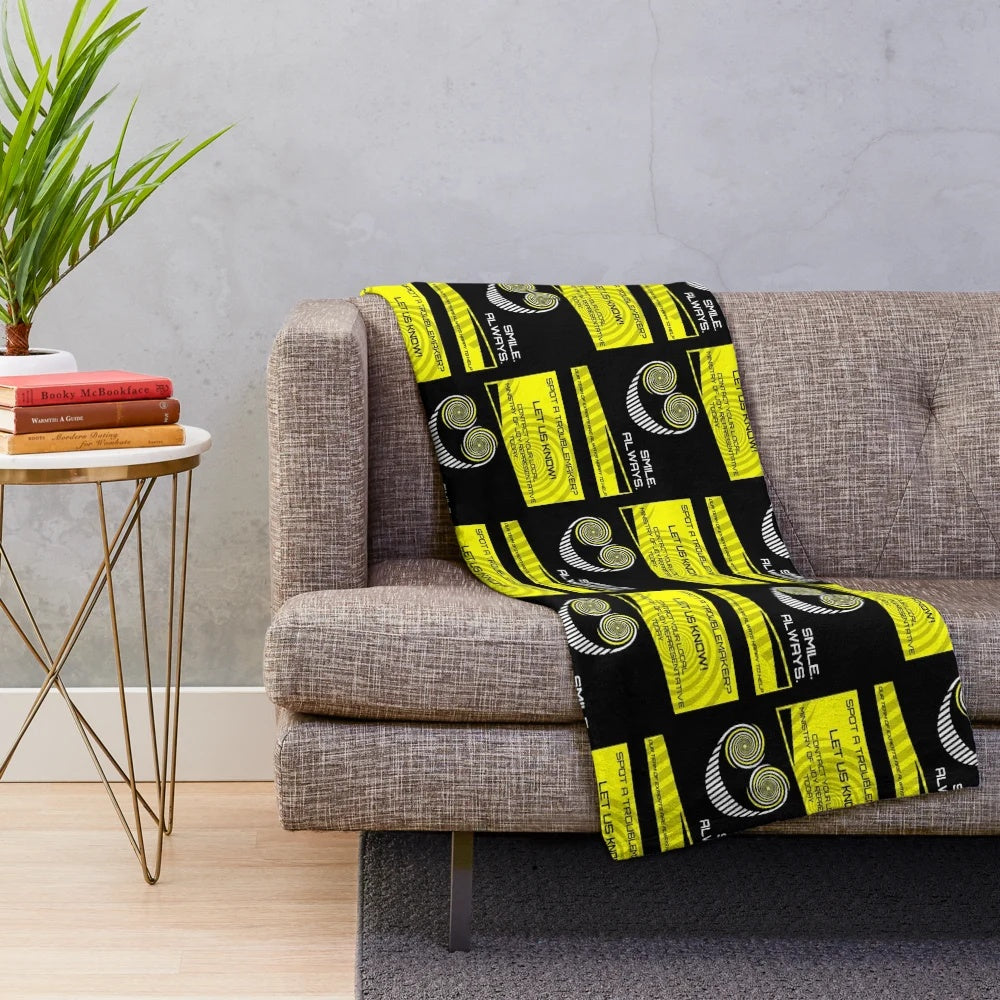 Plush blanket featuring a smiling character