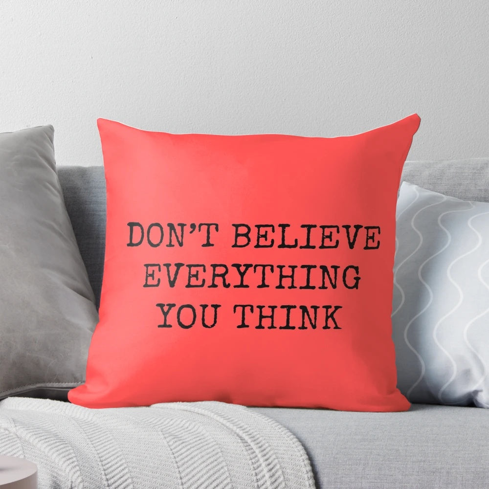 Don't Believe Everything You Think" Pillow featuring a calming, philosophical design