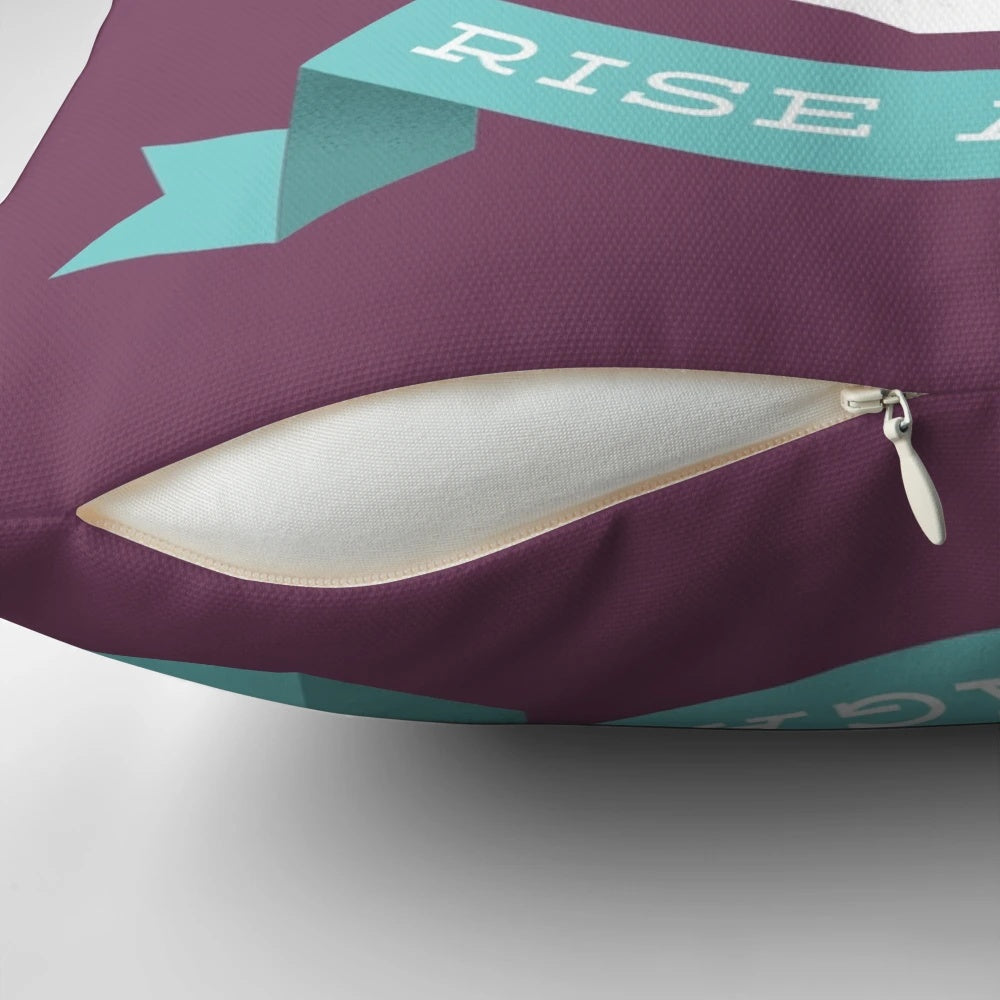Rise Again Pillow featuring a sun rising over a skull, symbolizing new life and optimism.