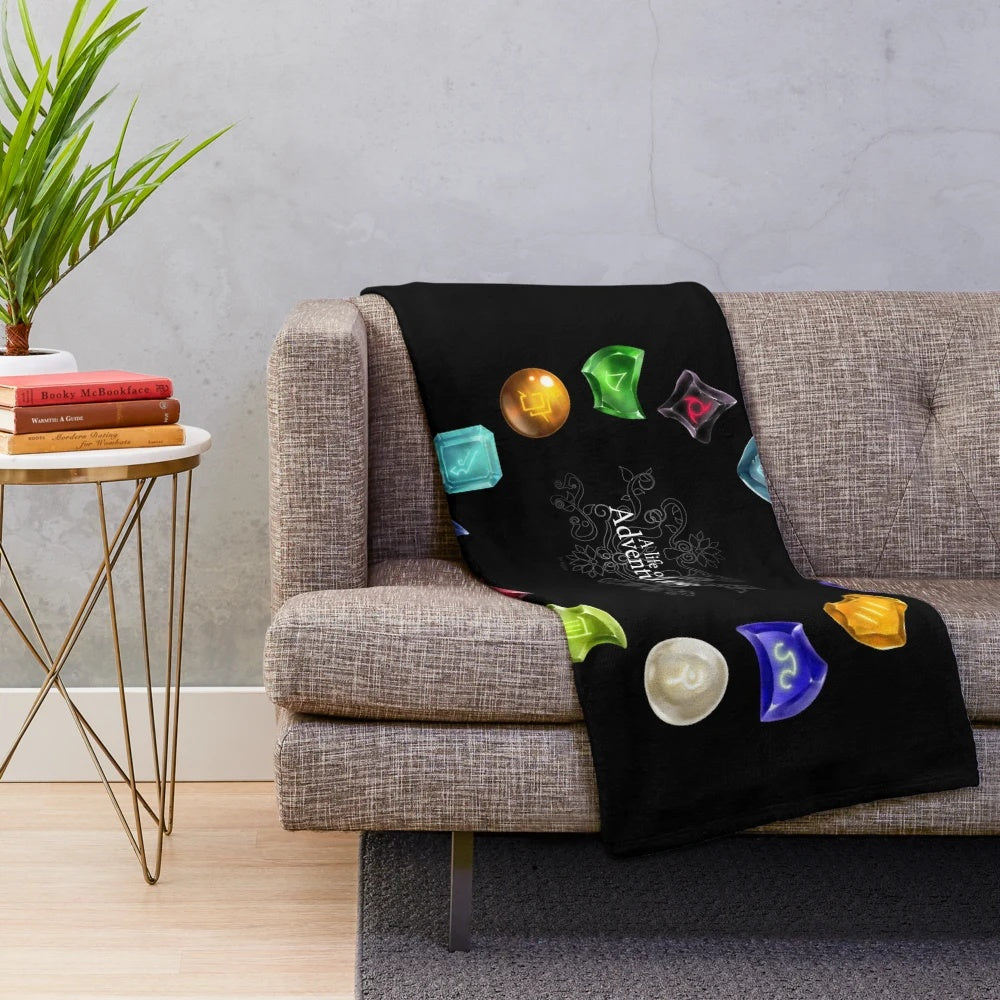 A cozy plush blanket featuring a final fantasy-inspired adventure theme with crystals and gems