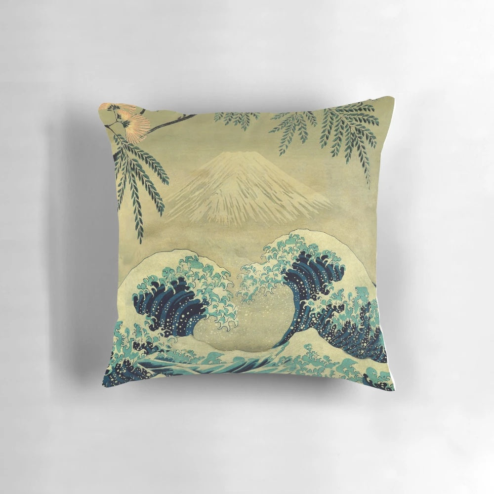 A nature-inspired landscape pillow featuring the iconic "Great Wave off Kanagawa" design in shades of blue and gold.