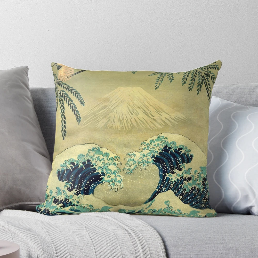 A nature-inspired landscape pillow featuring the iconic "Great Wave off Kanagawa" design in shades of blue and gold.