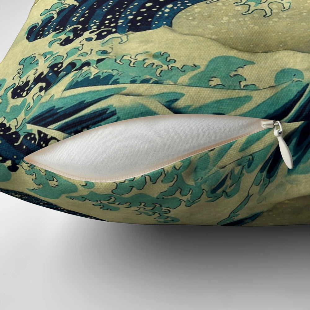 A nature-inspired landscape pillow featuring the iconic "Great Wave off Kanagawa" design in shades of blue and gold.
