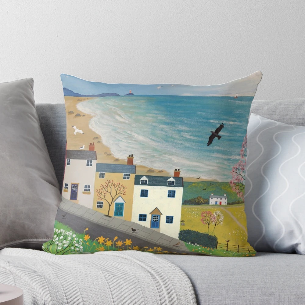 A colorful spring-themed pillow featuring landscapes, wildlife, and nature imagery