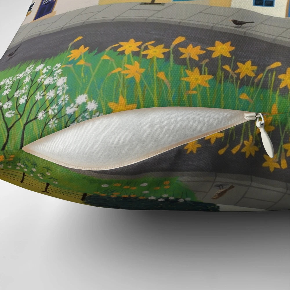 A colorful spring-themed pillow featuring landscapes, wildlife, and nature imagery