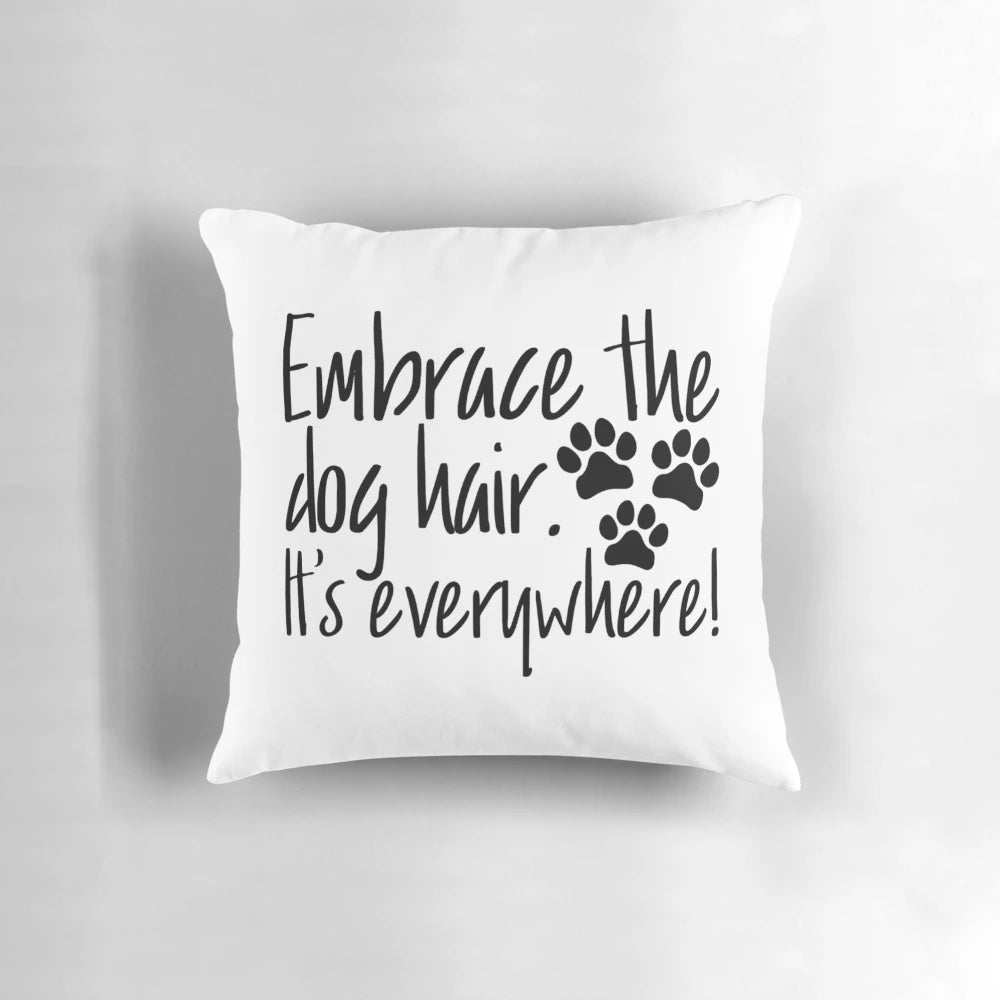 A fluffy white pillow filled with dog hair, perfect for dog lovers and pet owners.
