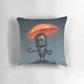 A whimsical gray and orange robot-shaped pillow holding an umbrella, capturing the emotions of the rainy season.