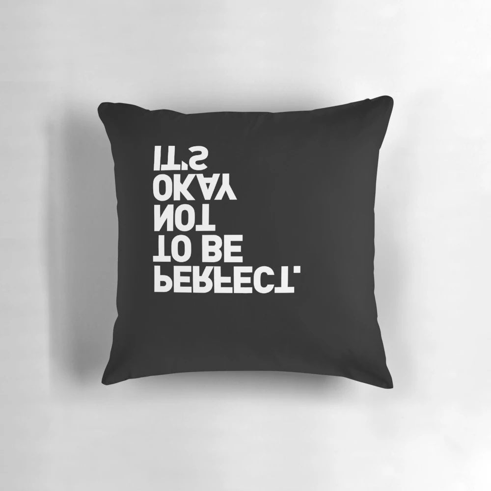 Black-and-white pillow with the text "YES, IT IS" printed upside-down, a playful and ironic home decor item.