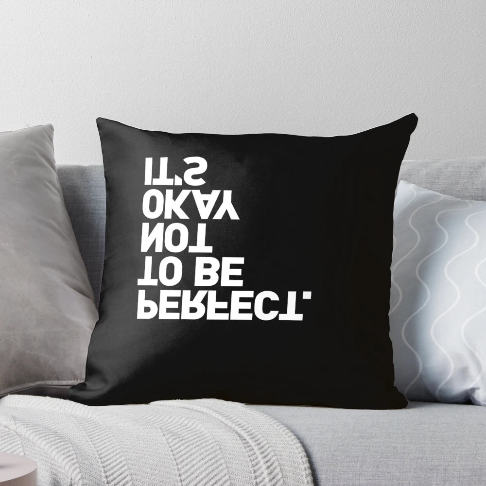 Black-and-white pillow with the text "YES, IT IS" printed upside-down, a playful and ironic home decor item.
