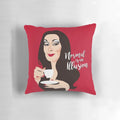 A decorative pillow featuring Morticia Addams, the iconic character from The Addams Family, against a dark, moody background.
