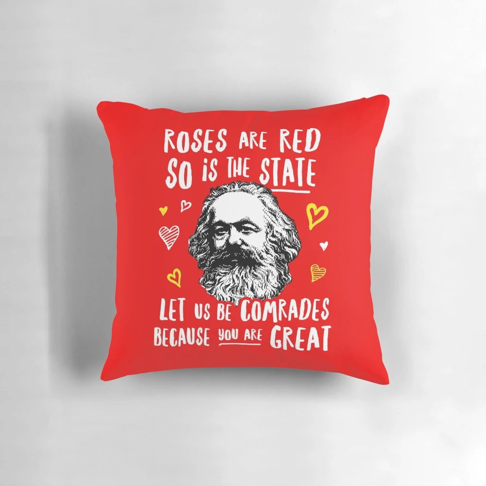 A plush, red pillow featuring the phrase "Roses Are Red, So Is the State. Let Us Be Comrades Because You Are Great.