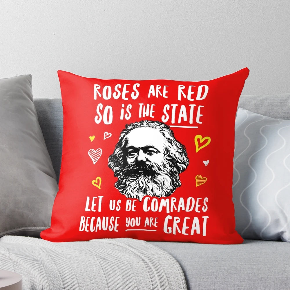 A plush, red pillow featuring the phrase "Roses Are Red, So Is the State. Let Us Be Comrades Because You Are Great.