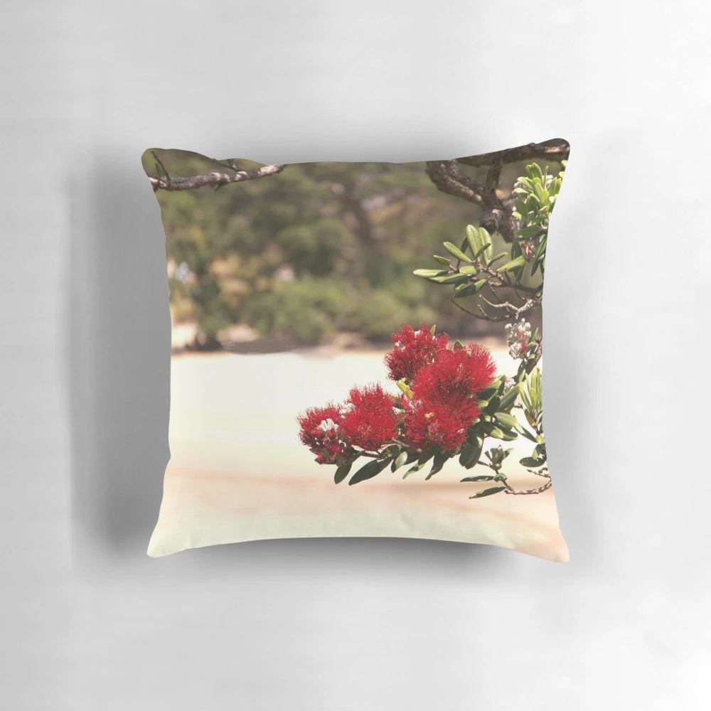 Vibrant red blooms of the Pohutukawa, New Zealand's iconic "Christmas tree", adorn this beautifully crafted pillow.