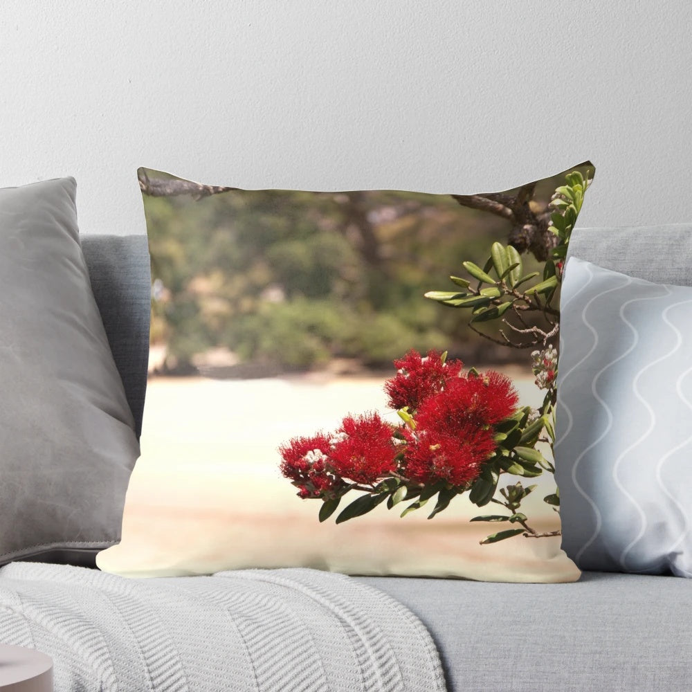 Vibrant red blooms of the Pohutukawa, New Zealand's iconic "Christmas tree", adorn this beautifully crafted pillow.