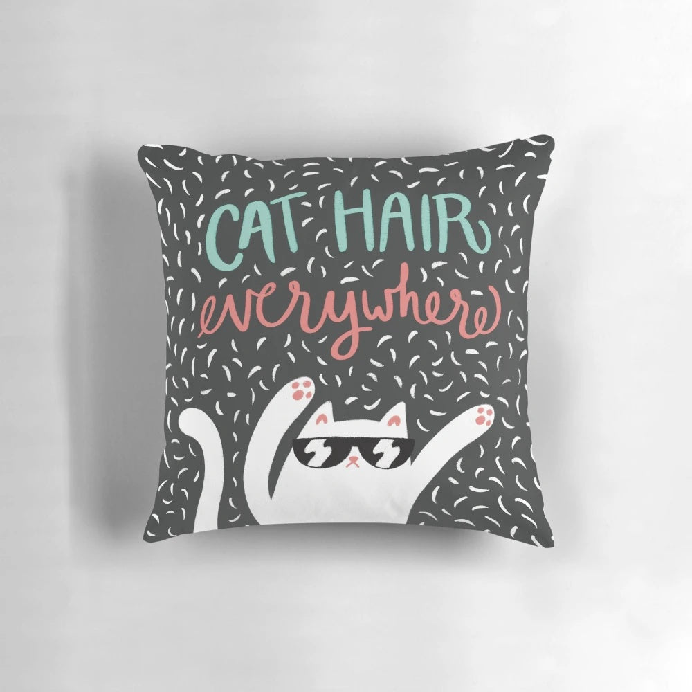 A soft, plush pillow covered in cat hair, perfect for the ultimate cat lover.