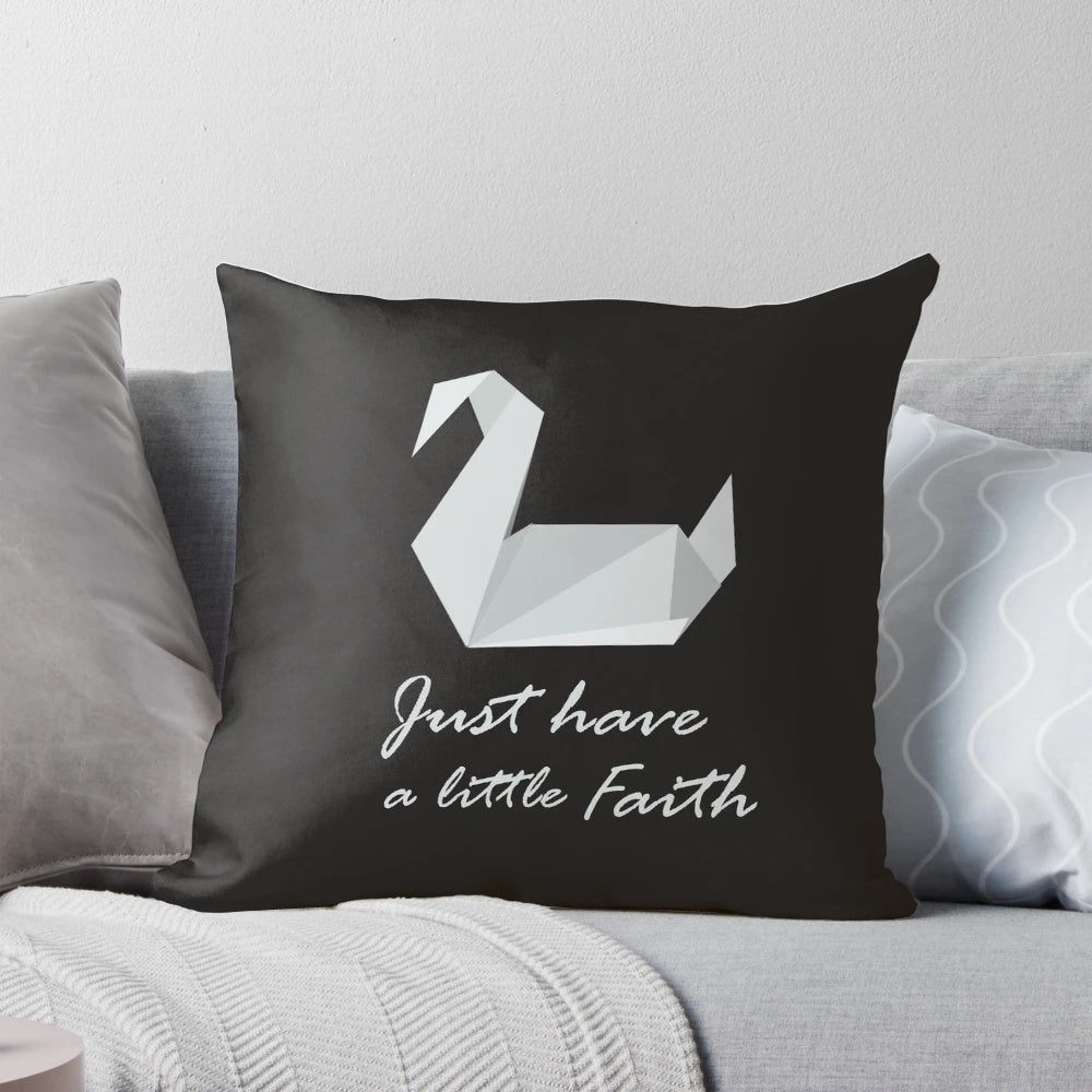 A cozy prison break-inspired pillow featuring an origami swan and the quote "Just Have a Little Faith"