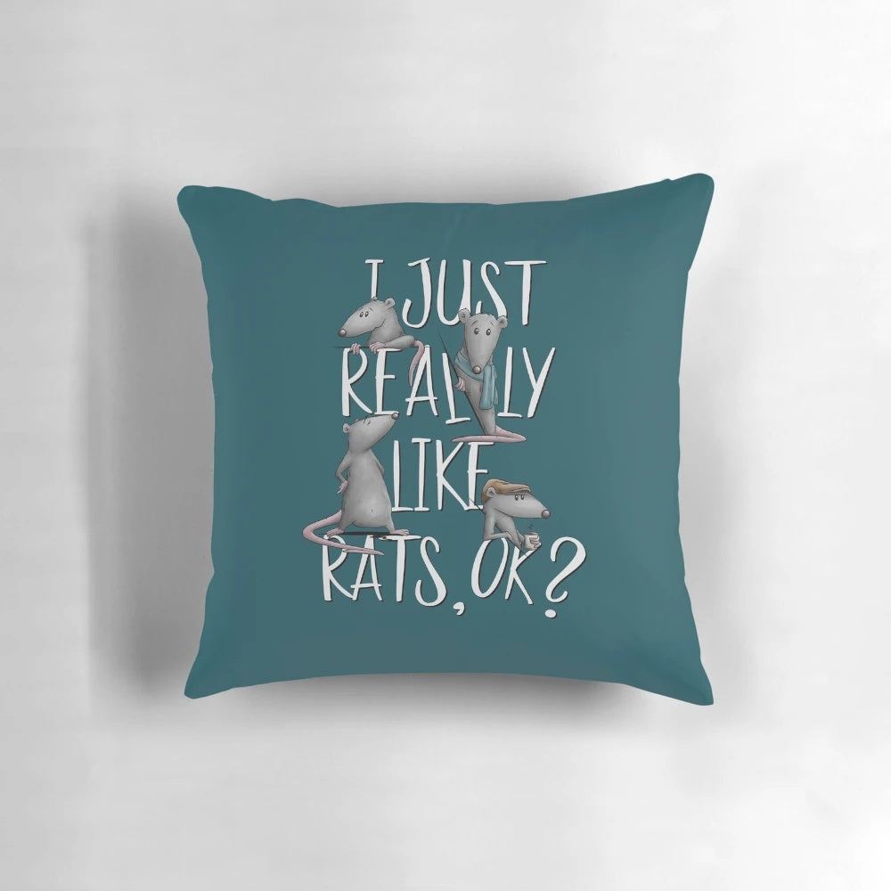 A cozy pillow featuring the text "I Just Really Like Rats, Ok?" with a fun and playful rat design.