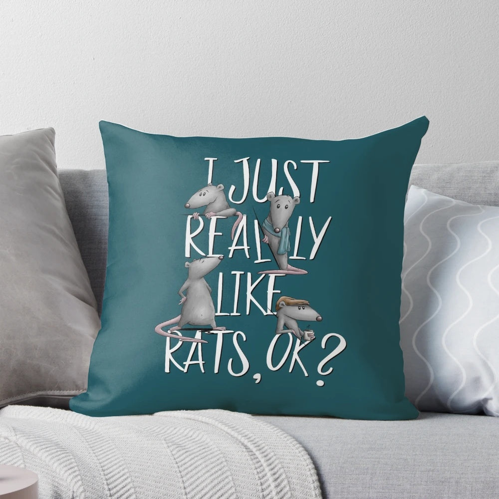 A cozy pillow featuring the text "I Just Really Like Rats, Ok?" with a fun and playful rat design.