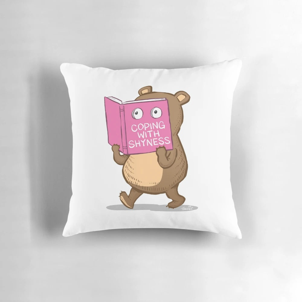 A soft, plush pillow in the shape of a shy bear, perfect for readers and introverts
