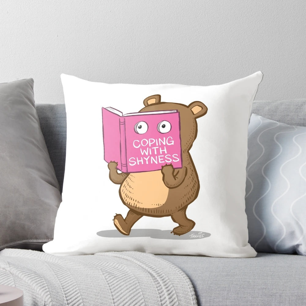A soft, plush pillow in the shape of a shy bear, perfect for readers and introverts