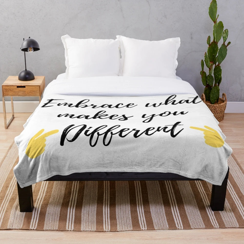 Plush blanket with the text "Embrace what makes you different