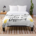 Plush blanket with the text "Embrace what makes you different