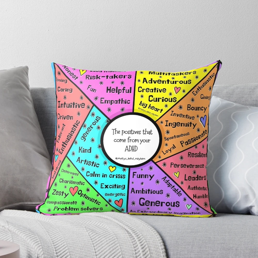A cozy pillow with the text "ADHD Positive" printed on it.