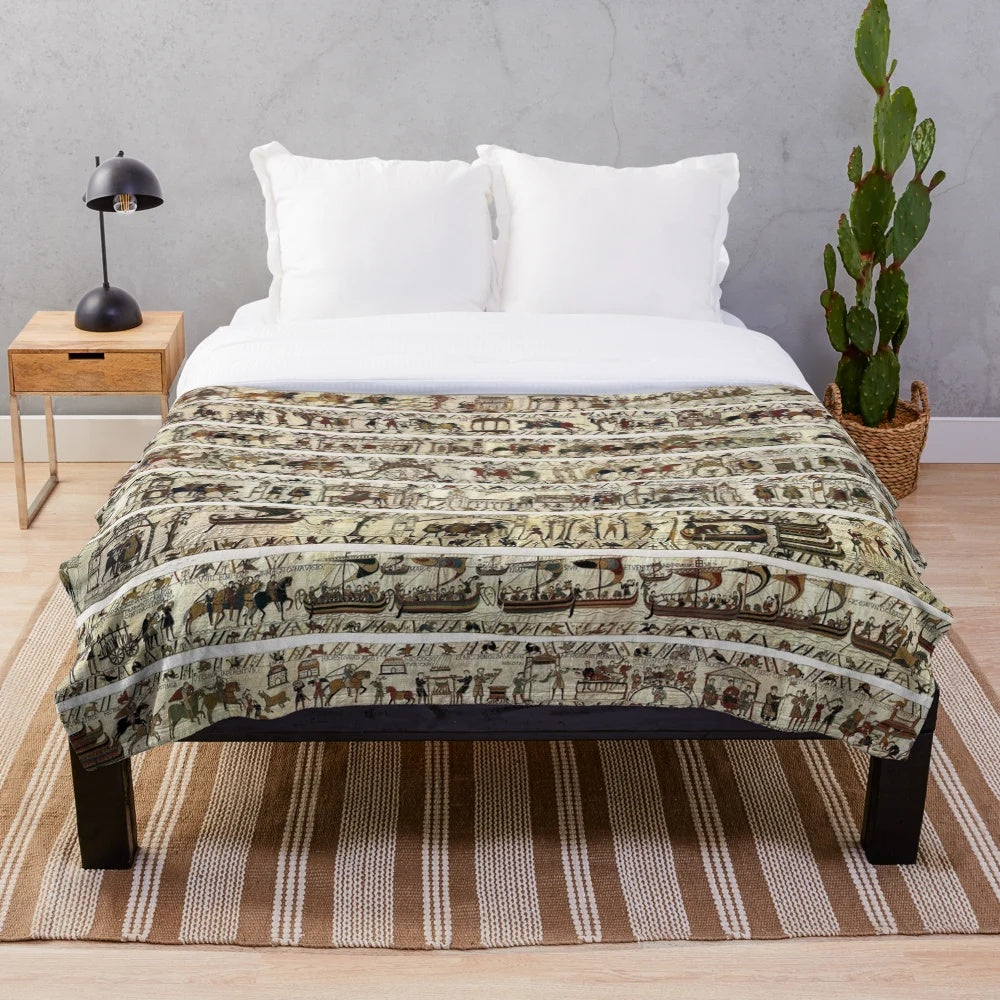 Embroidered plush blanket featuring the iconic Bayeux Tapestry imagery