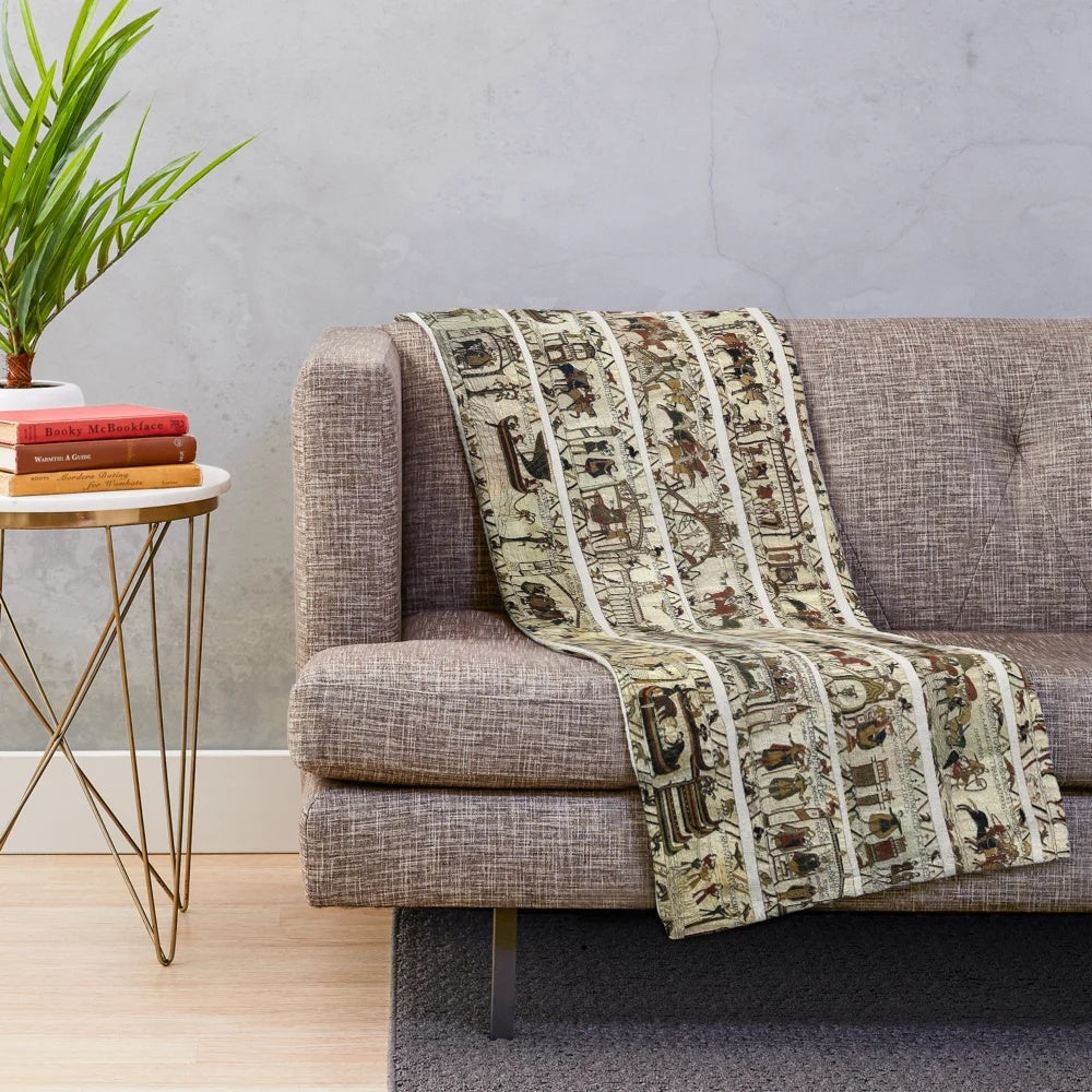 Embroidered plush blanket featuring the iconic Bayeux Tapestry imagery