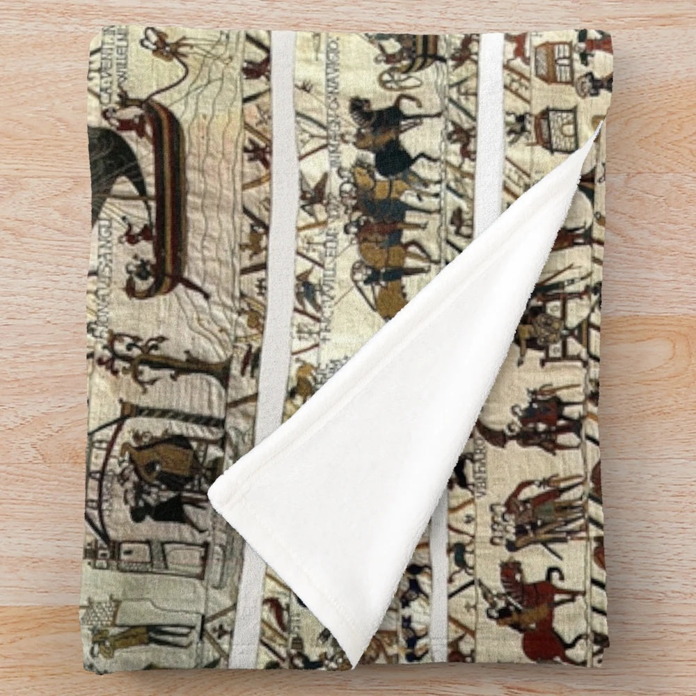 Embroidered plush blanket featuring the iconic Bayeux Tapestry imagery