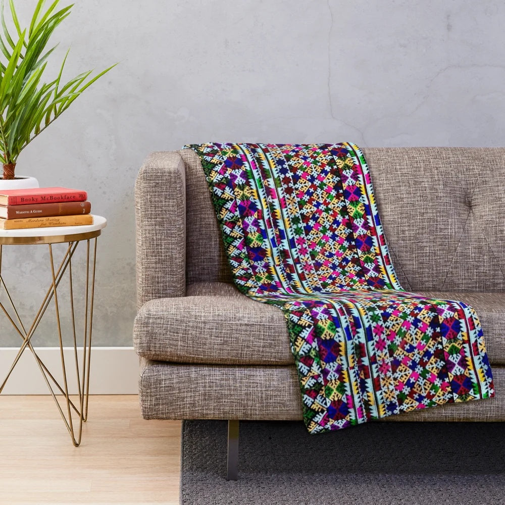Colorful embroidered plush blanket with Iu Mien inspired floral pattern
