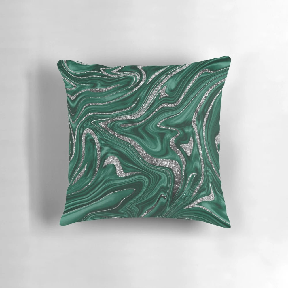 Emerald green and black silver marble patterned pillow with a liquified, wavy texture