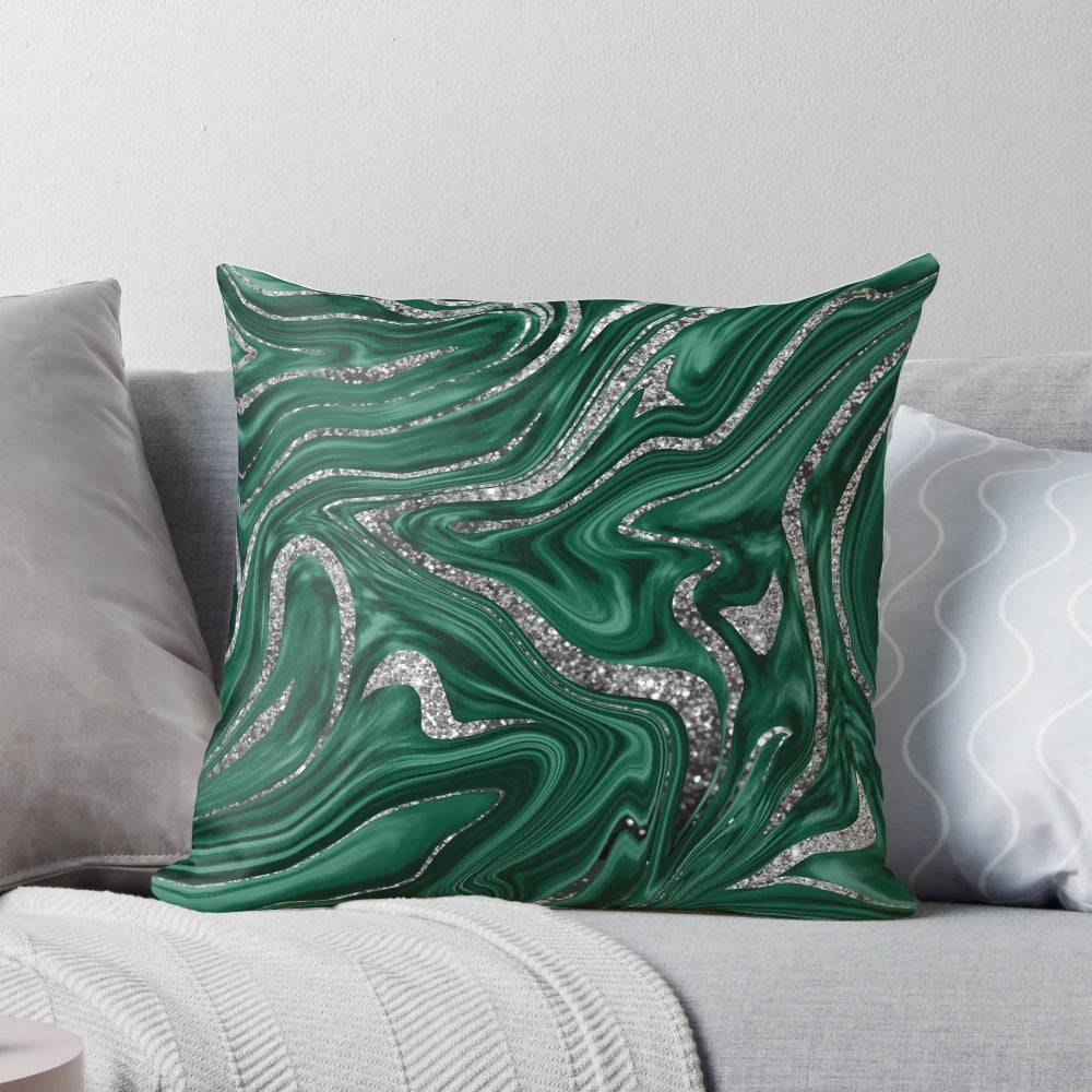 Emerald green and black silver marble patterned pillow with a liquified, wavy texture
