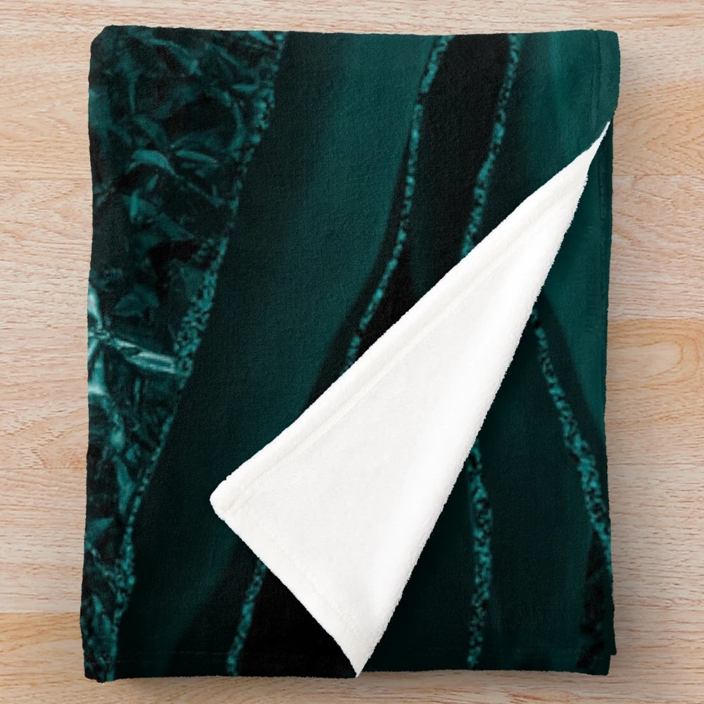 Emerald green plush blanket with marble and agate inspired patterns